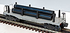 Lionel 2411 Flatcar with Pipes and Stakes - Postwar